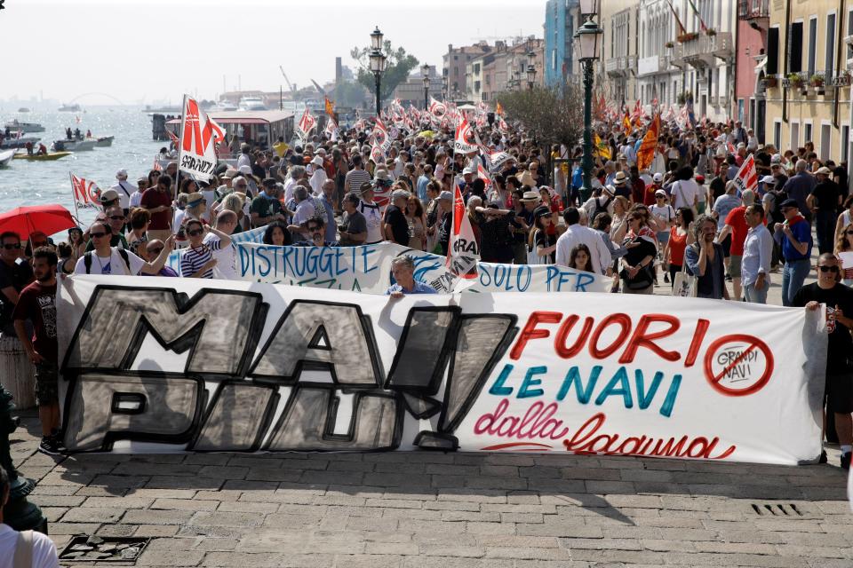 People march during a demonstration against cruise ships being allowed in the lagoon, in Venice, Italy, June 8, 2019.