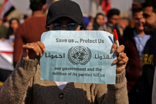 A demonstrator in Baghdad's Tahrir Square appeals for protection after a night of violence blamed on supporters of populist cleric Moqtada Sadr