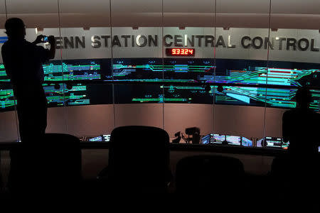 A man takes a photo of the Penn Station Control Room for Amtrak and the Long Island Rail Road in the Manhattan borough of New York City, New York, U.S. July 25, 2017. REUTERS/Carlo Allegri