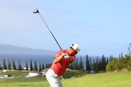 Jan 5, 2019; Maui, HI, USA; PGA golfer Gary Woodland tees off on the 18th hole during the third round of the Sentry Tournament of Champions golf tournament at Kapalua Resort - The Plantation Course. Mandatory Credit: Brian Spurlock-USA TODAY Sports