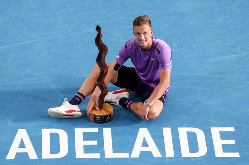 Czech Tennis player Jiri Lehecka poses with the trophy after victory against the UK's Jack Draper during their Men's Singles Final match of the 2024 Adelaide International at Memorial Drive Tennis Centre. Matt Turner/AAP/dpa
