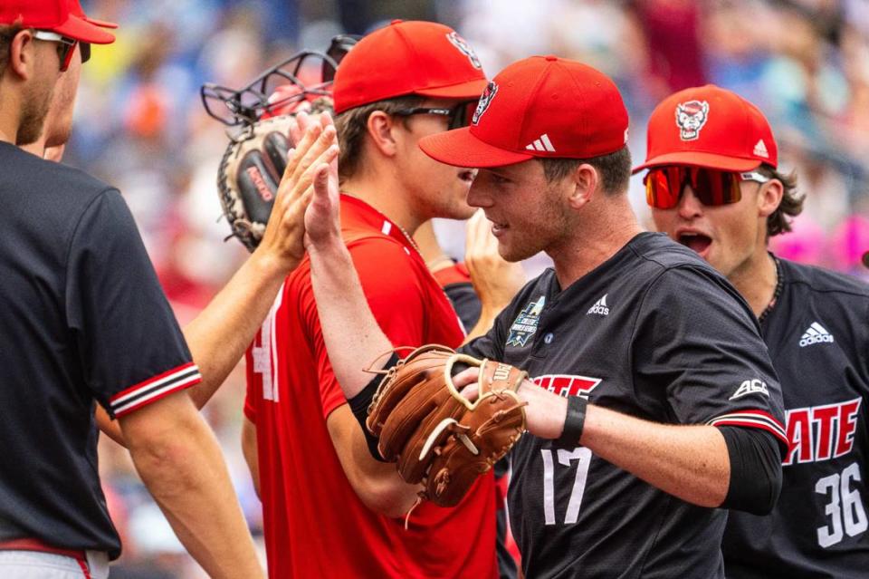 NC State Wolfpack starting pitcher Sam HIghfill (17) greets teammates during the seventh inning against the Kentucky Wildcats at Charles Schwab Filed Omaha.