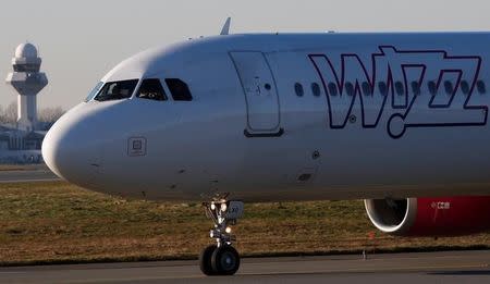 FILE PHOTO: A Wizz Air Airbus 321-231HA-LXJ aircraft taxis to runway at the Chopin International Airport in Warsaw, Poland January 8, 2018. REUTERS/Kacper Pempel