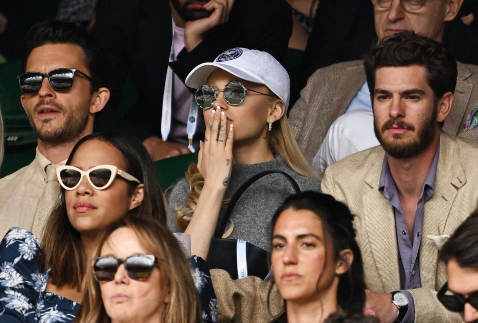 Actor Jonathan Bailey, singer Ariana Grande and actor Andrew Garfield in the stands during the men's singles final (REUTERS)