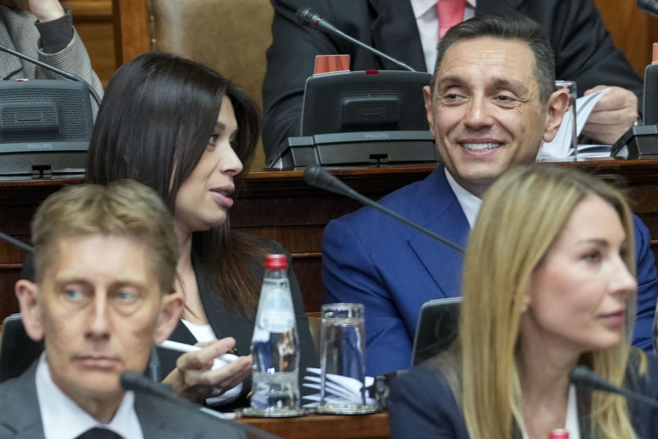 Aleksandar Vulin, former director of Serbia's intelligence agency, right, smiles during a parliament session while Serbia's prime minister designate Milos Vucevic presents a plan for the new government to the parliament members in Belgrade, Serbia, Wednesday, May 1, 2024. Serbia's new government will include a former intelligence chief, Aleksandar Vulin who has fostered close ties with Russia and is sanctioned by the United States. (AP Photo/Darko Vojinovic)