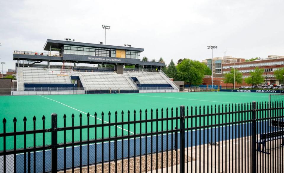 Construction crews work on the new locker rooms, bleachers and press box at the Penn State field hockey stadium on Thursday, May 9, 2024.