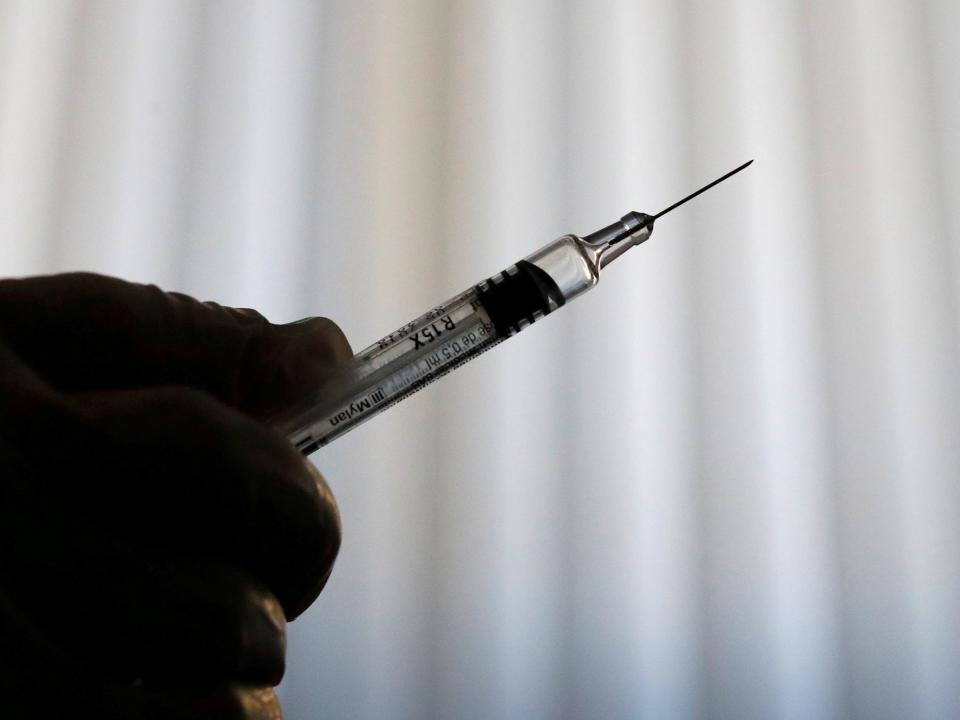 FILE PHOTO: A doctor prepares a syringe as part of the start of the seasonal influenza vaccination campaign in Nice, France October 24, 2018.   REUTERS/Eric Gaillard