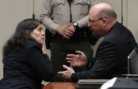 Attorney Jeff Moore speaks with Louise Turpin as she and David Turpin (not pictured) appear in court in Riverside, California, U.S., February 23, 2018. REUTERS/Gina Ferazzi/Pool