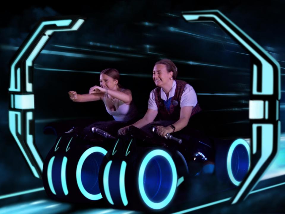 author riding tron rollercoast at magic kingdom with a vip tour guide