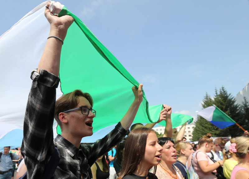 People take part in a rally in support of arrested governor Sergei Furgal in Khabarovsk