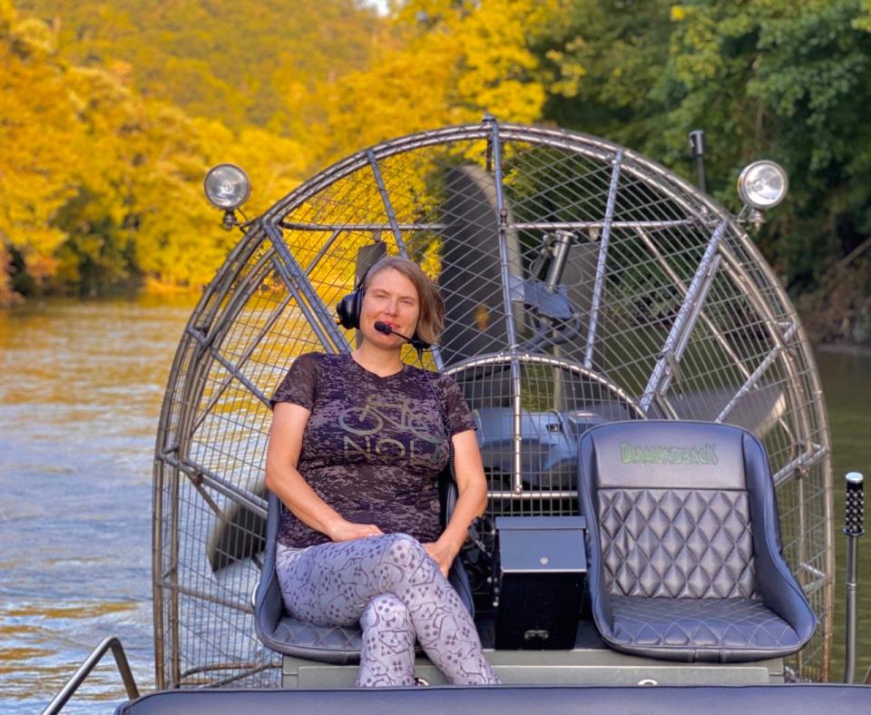 Author sitting on a fan-powered boat