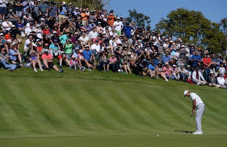 Feb 16, 2018; Pacific Palisades, CA, USA; Tiger Woods putts on the second green during the second round of the Genesis Open golf tournament at Riviera Country Club. Mandatory Credit: Orlando Ramirez-USA TODAY Sports