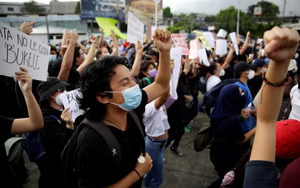 Members of civil society organizations demonstrate against the dismissal of magistrates of the Constitutional Chamber of the Supreme Court of Justice in San Salvador, Salvador, 02 May 2021 - Rodrigo Sura/Shutterstock