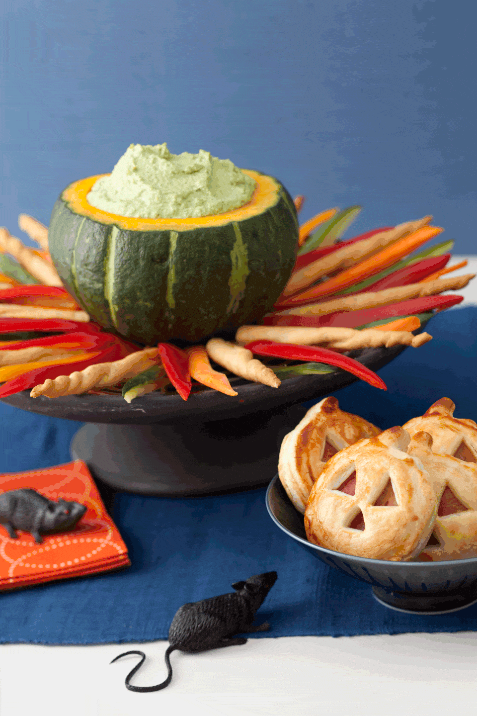 <p>What's a Halloween party without a good dip? Made from good-for-you edamame and low-fat ricotta cheese, serve dip in a large acorn squash atop a "fire" of crudité and breadsticks.<br></p><p><a href="https://www.womansday.com/food-recipes/food-drinks/recipes/a11350/cauldron-dip-recipe-122710/" rel="nofollow noopener" target="_blank" data-ylk="slk:Get the Cauldron Dip recipe.;elm:context_link;itc:0;sec:content-canvas" class="link "><em>Get the Cauldron Dip recipe.</em></a></p>