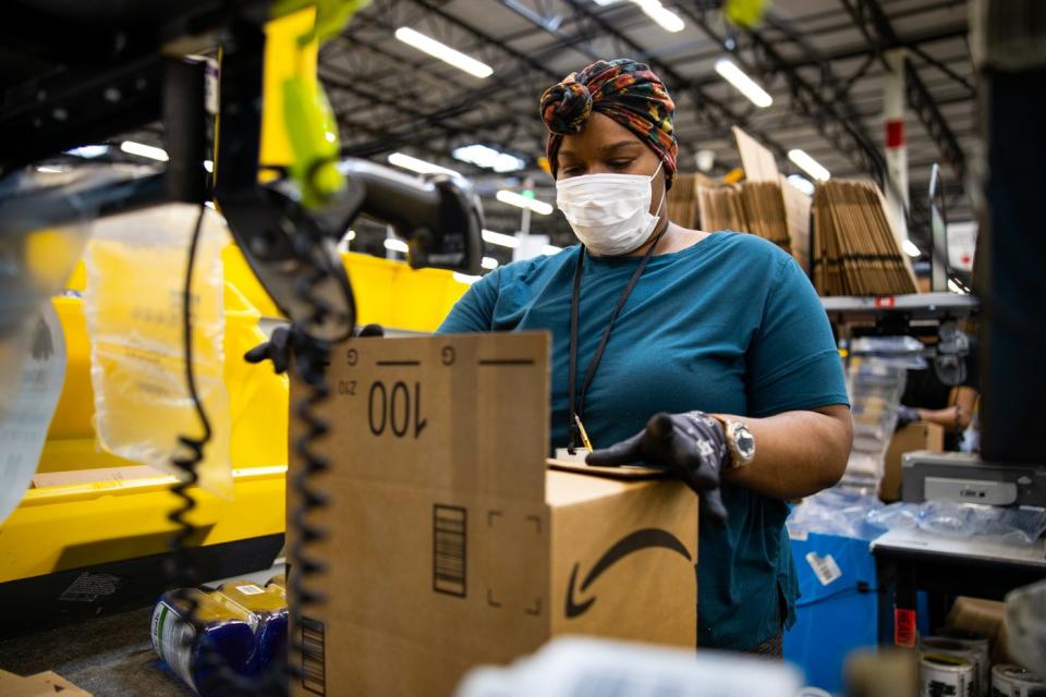 An Amazon worker in a warehouse.