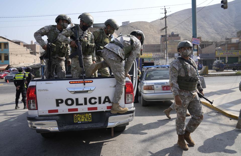 Special Forces Police arrive to a checkpoint in the Manchay district, on the outskirts of Lima, Peru, Tuesday, April 5, 2022. Peru’s President Pedro Castillo has imposed a curfew on the capital and the country’s main port in response to sometimes violent protests over rising prices of fuel and food. (AP Photo/Martin Mejia)