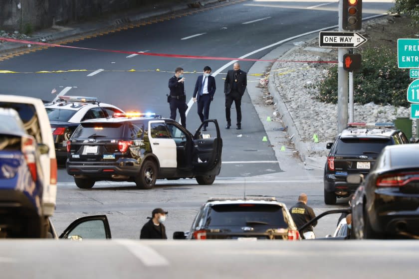 LOS ANGELES, CA MARCH 29, 2021 -- An investigation is underway after LAPD officers shot and killed a man allegedly armed with a handgun early Monday morning, March 29, 2021, in the Westlake area. The shooting happened about 3:50 a.m. at Eighth and Bixel streets. The wounded man was taken to a hospital, where he died. (Al Seib / Los Angeles Times)