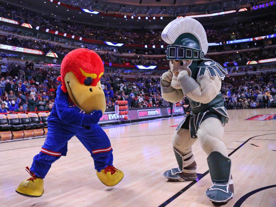 Nov 17, 2015; Chicago, IL, USA; The Kansas Jayhawks and Michigan State Spartans mascots spar before the first half at the United Center. Mandatory Credit: Dennis Wierzbicki-USA TODAY Sports