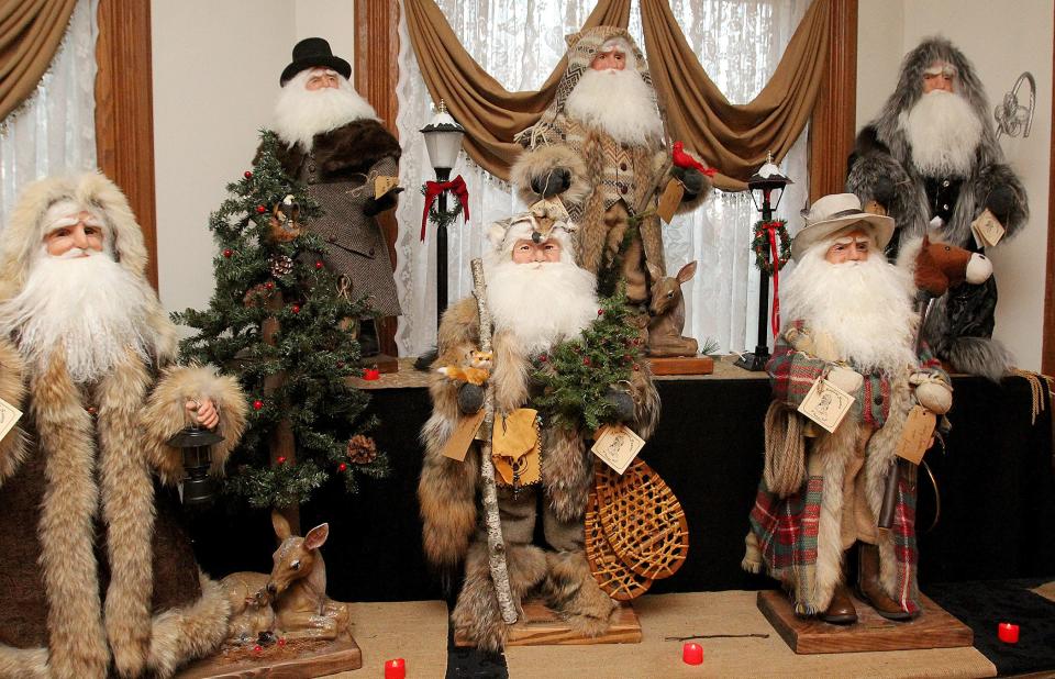 Some of the unique varieties of Santas created by Barbara Buck in her home studio in Freeport are seen here on Tuesday, Nov. 30, 2021.