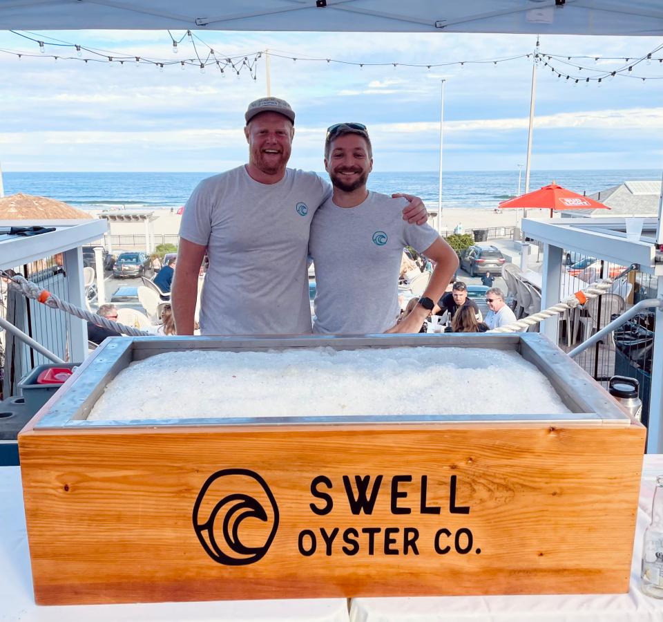 Swell Oyster Co. owner Russ Hilliard (left) and Chris Raymond at last year's Oysterfest at Bernie's Beach Bar. Oyster Week returns to the Seacoast and Bernie's Sept. 18-24.