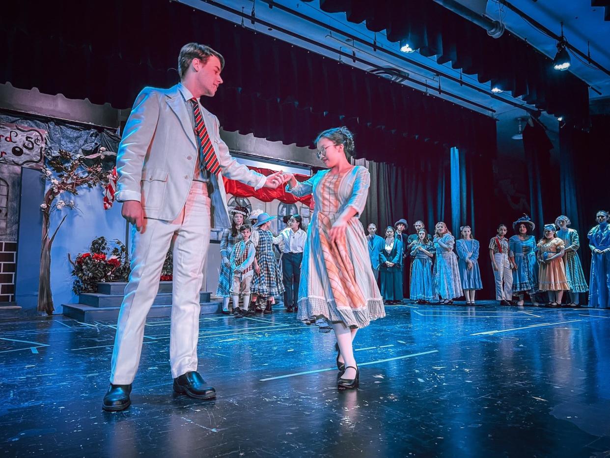 Shane Mulvey as Harold Hill makes a young friend in River City, ensemble member Emma McCarthy, in Pearl River High School's production of "The Music Man." A performance for Pearl River senior citizens at 3:30 p.m., April 18. Then at 7 p.m., April 19 and at 2 and 7 p.m., April 20.