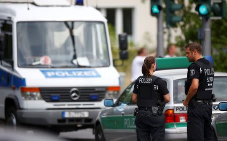 Police secures the area near the university clinic in Steglitz, a southwestern district of Berlin, July 26, 2016 after a doctor had been shot at and the gunman had killed himself. REUTERS/Hannibal Hanschke