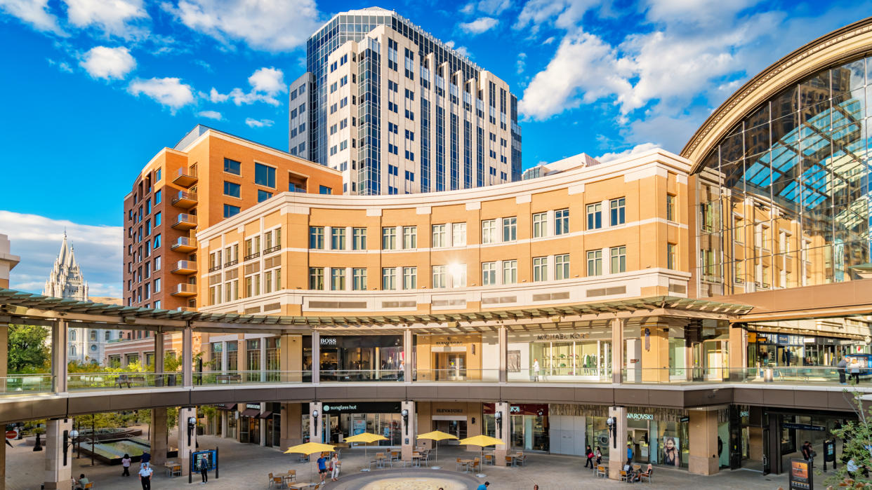 People walk at City Creek Center shopping mall in downtown Salt Lake City, Utah, USA, on a sunny day.