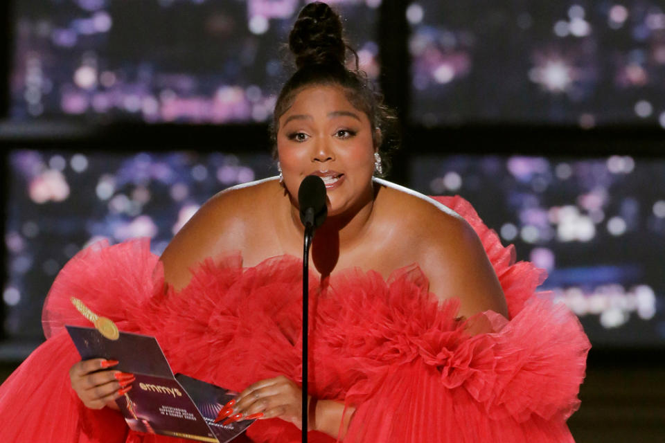 Lizzo onstage at the 2022 Emmy Awards, in a Giambattista Valli tulle gown. - Credit: Getty