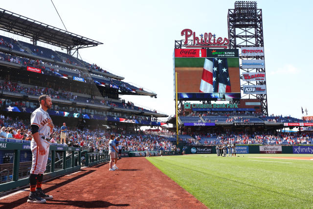 Giants manager Gabe Kapler stands on the field for national anthem on  Memorial Day