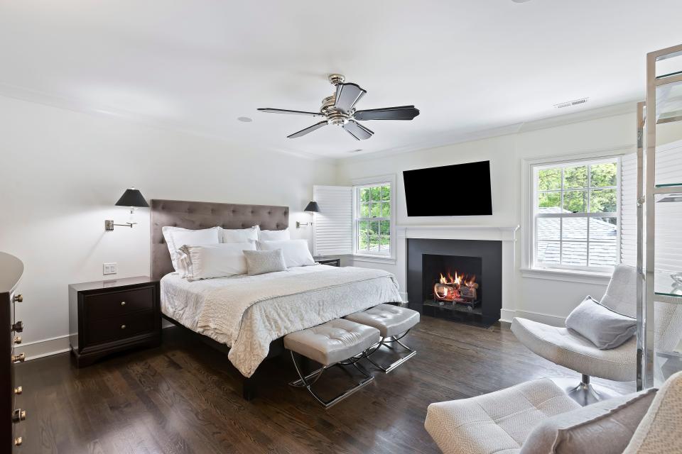 A primary bedroom with a gas fireplace.