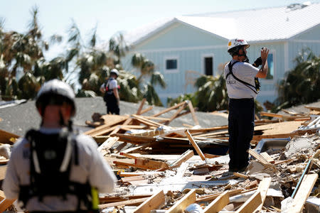 A search and rescue team works in homes destroyed by Hurricane Michael in Mexico Beach, Florida, U.S., October 16, 2018. REUTERS/Terray Sylvester
