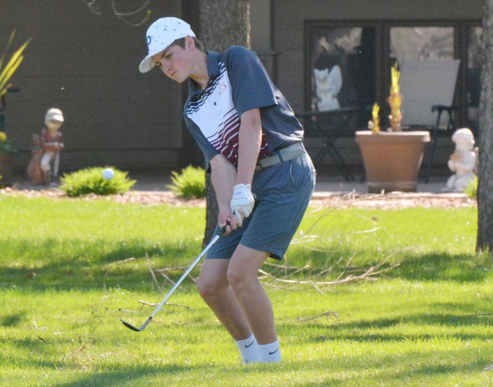 Blaize Amdahl of Webster Area pitches to the green on No. 5 Yellow during the Pre-Region 1B/Eastern Coteau Conference golf tournament at Cattail Crossing Golf Course.