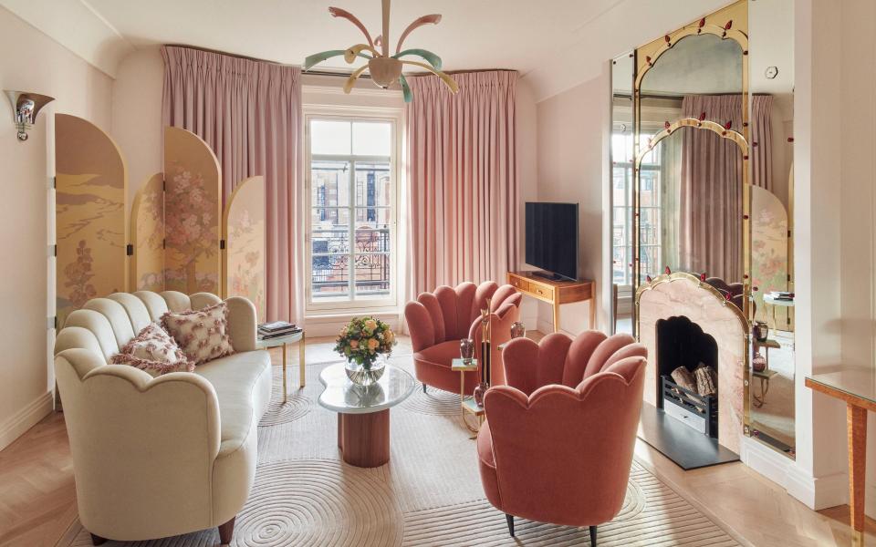 pink sofas and curtains in room at Claridge's - JAMIE MCGREGOR SMITH