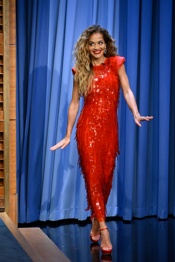 Rita Ora on "The Tonight Show Starring Jimmy Fallon" on July 9, sequins, shoulder pads, Sportmax, red dress, Chopard