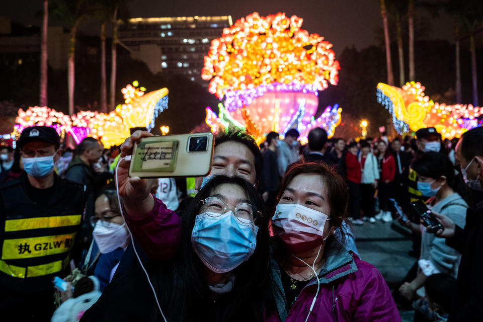 People take a selfie in Guangzhou Cultural Park during the Lantern Festival in China, Feb. 5, 2023.