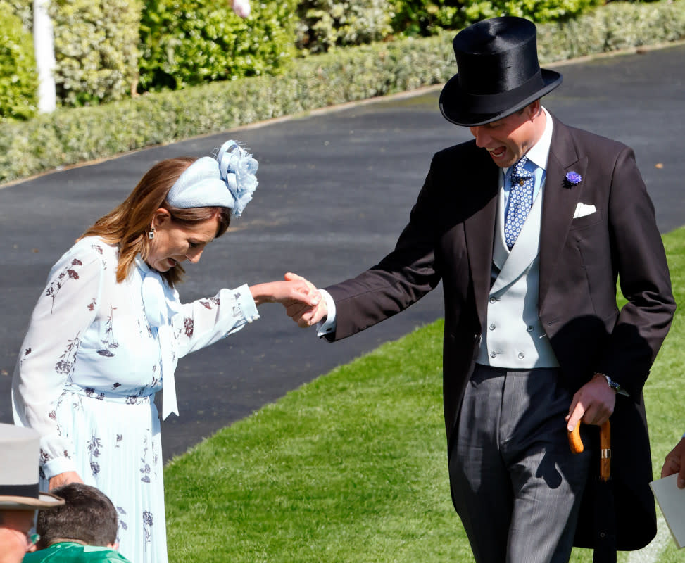 ASCOT, UNITED KINGDOM - JUNE 19: (EMBARGOED FOR PUBLICATION IN UK NEWSPAPERS UNTIL 24 HOURS AFTER CREATE DATE AND TIME) Prince William, Prince of Wales assists Carole Middleton as she gets the heel of her shoe stuck in the grass on day two of Royal Ascot 2024 at Ascot Racecourse on June 19, 2024 in Ascot, England. (Photo by Max Mumby/Indigo/Getty Images)<p>Max Mumby/Indigo/Getty Images</p>