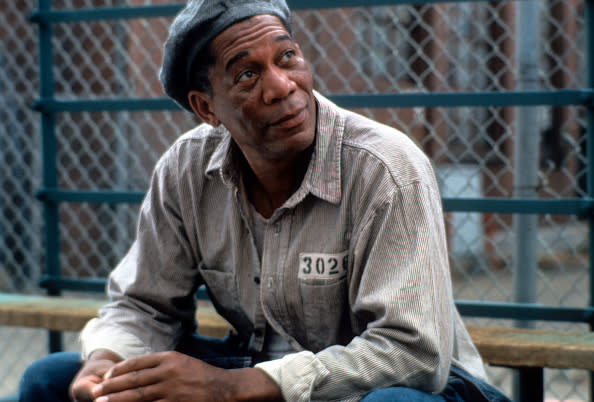 Morgan Freeman sitting outside with a hat and prison uniform on in a scene from the film ‘The Shawshank Redemption’, 1994. (Photo by Castle Rock Entertainment/Getty Images)