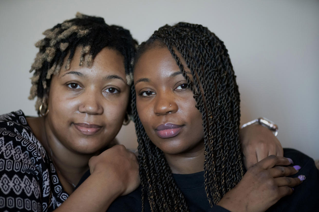 Sisters Angelica Lyons, left, and Ansonia Lyons pose for a portrait at their parents' home in Birmingham, Ala. (AP Photo/Wong Maye-E)