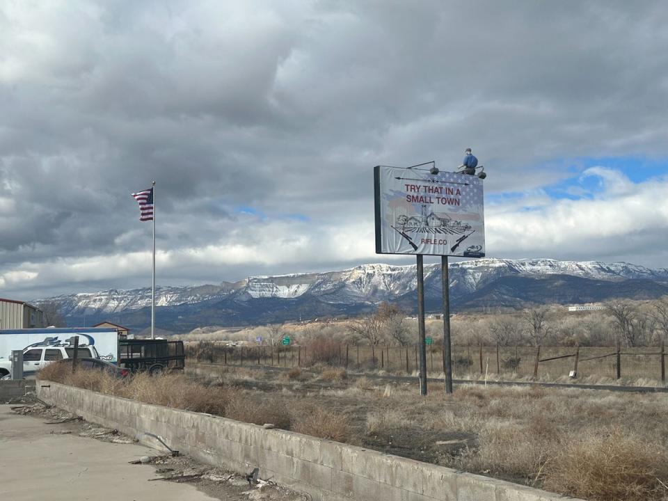 Boebert’s CD3 voter base is conservative and initially embraced her gun-toting, brash image; a sign in Rifle showcases those local values (Sheila Flynn)