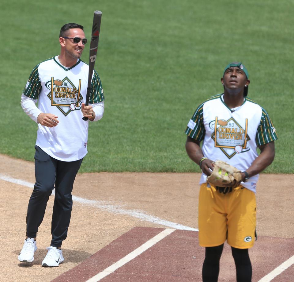 Green Bay Packers coach Matt LaFleur and Donald Driver share a moment during the Donald Driver Charity Softball Game on Sunday at Neuroscience Group Field at Fox Cities Stadium in Grand Chute.
