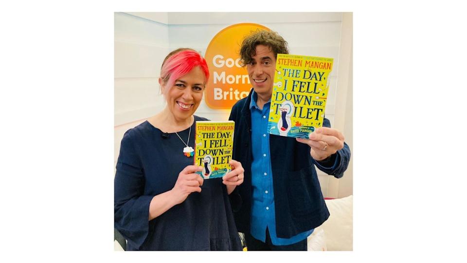 Anita and Stephen mangan holding up books