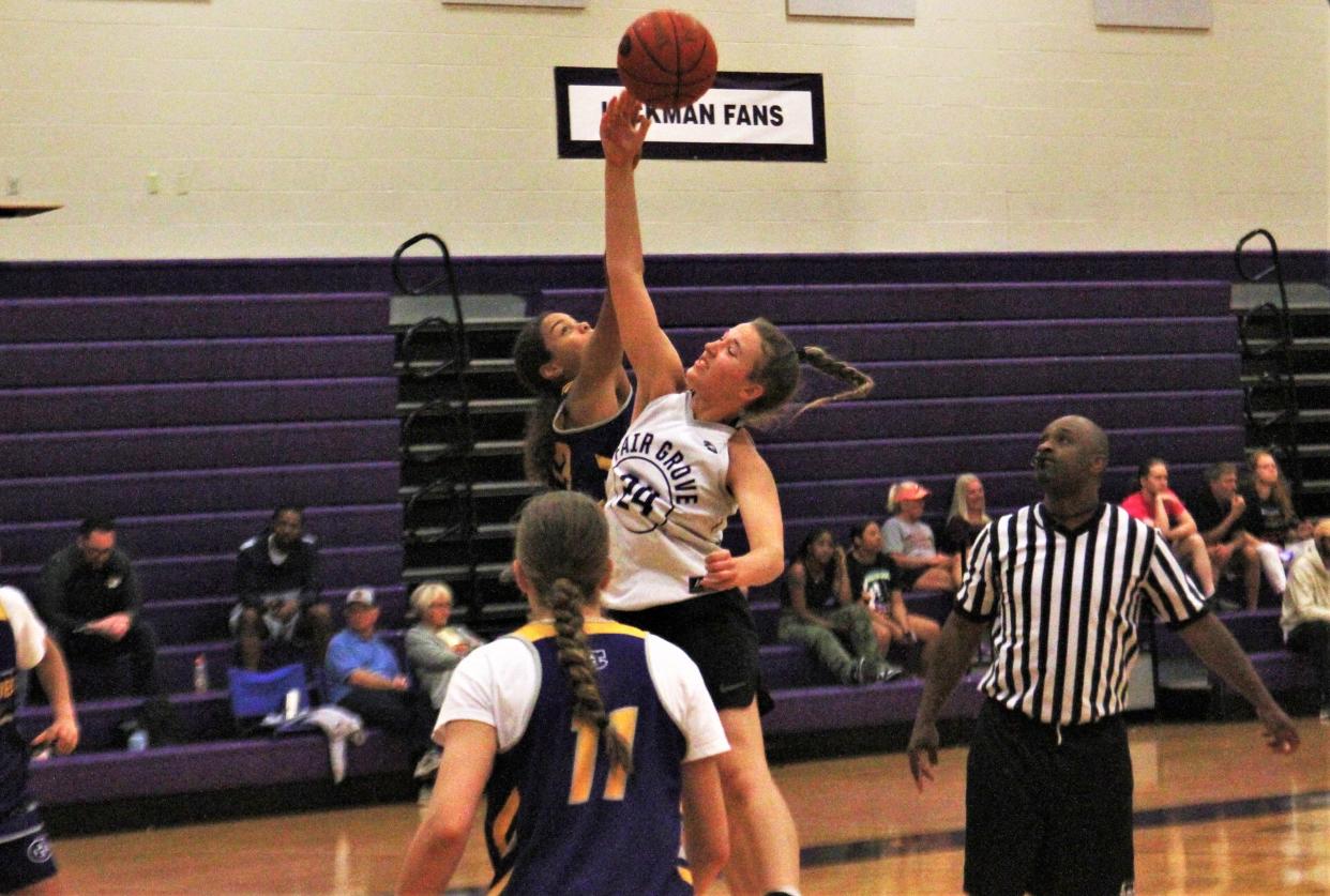 Hickman's Sy'Rae Stemmons jumps for a jump ball during a game against Fair Grove during the 2023 Kewpie's Shootout on June 10, 2023, at Hickman High School.