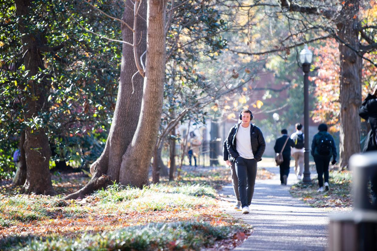 A student walks across campus at Vanderbilt University in Nashville, Tenn., Monday, Nov. 27, 2023.