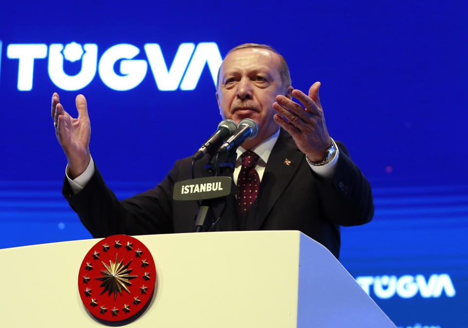 Turkey's President Recep Tayyip Erdogan addresses a meeting of a youth organisation founded by his elder son Bilal Erdogan and his friends, in Istanbul Saturday, Dec. 22, 2018. Erdogan said Friday the United States decided to withdraw troops from Syria after he reassured U.S. President Donald Trump that Turkey could eradicate the remnants of Islamic State group from the country with logistical help from Washington.(Presidential Press Service via AP, Pool)