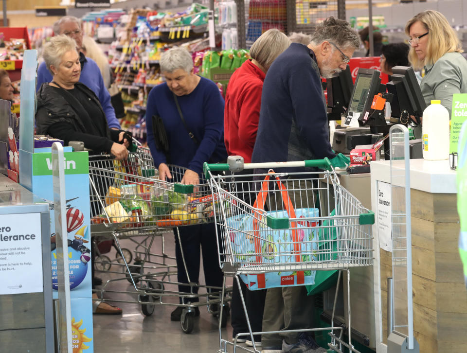 Woolworths opens it doors at Kew in Melbourne from 7am to 8am for the elderly to do their shopping as panic buying worsens. Source: AAP