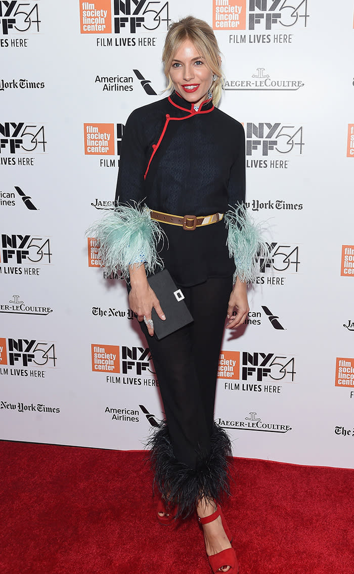 Miller and her feather cuffs. (Photo: Getty Images)