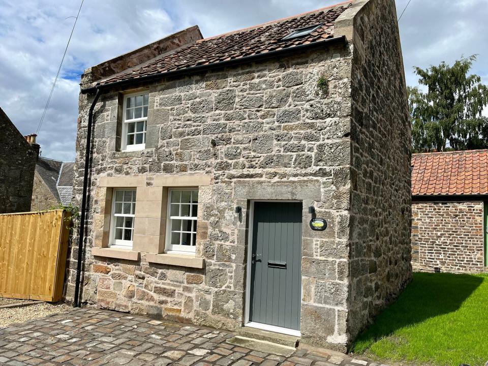 The exterior of the renovated house.