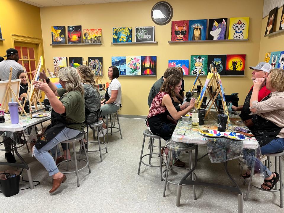 Action is nonstop while painters are doing their creating during a session at Painting With a Twist in Powell.