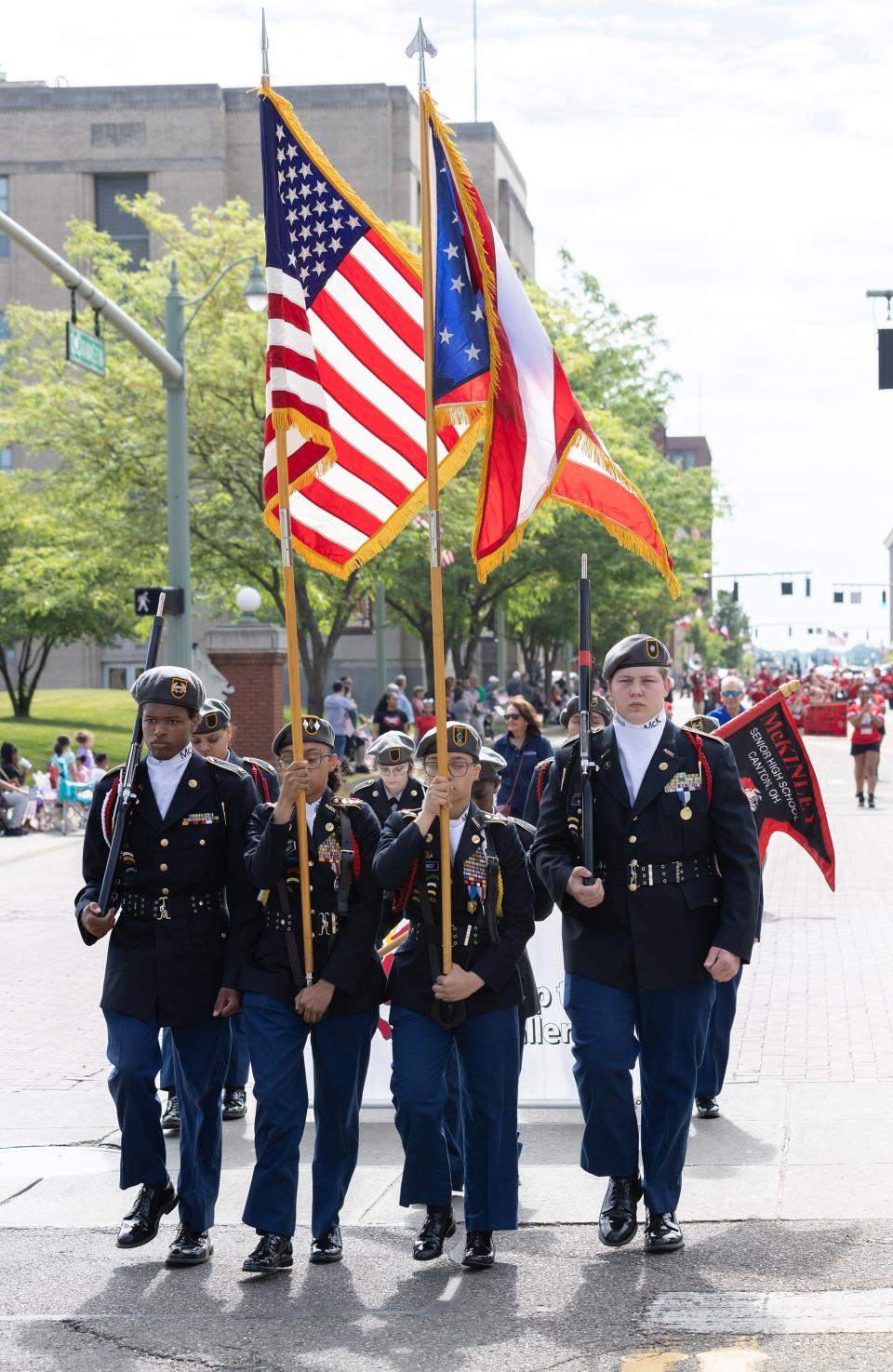 A color guard marches Monday in Canton's Memorial Day parade.