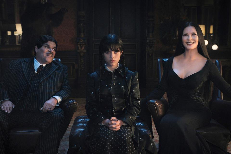 Wednesday. (L to R) Luis Guzmán as Gomez Addams, Jenna Ortega as Wednesday Addams, Catherine Zeta-Jones as Morticia Adams in episode 101 of Wednesday. Cr. Courtesy Of Netflix © 2022